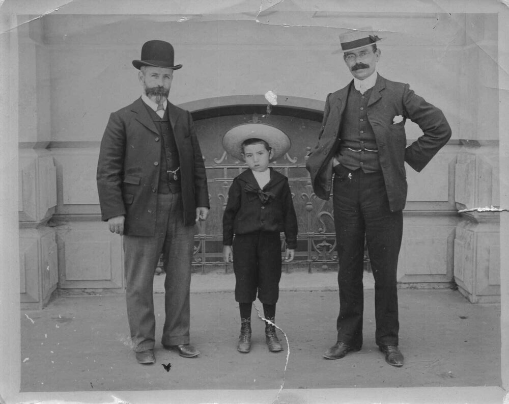 Two adult men and a boy