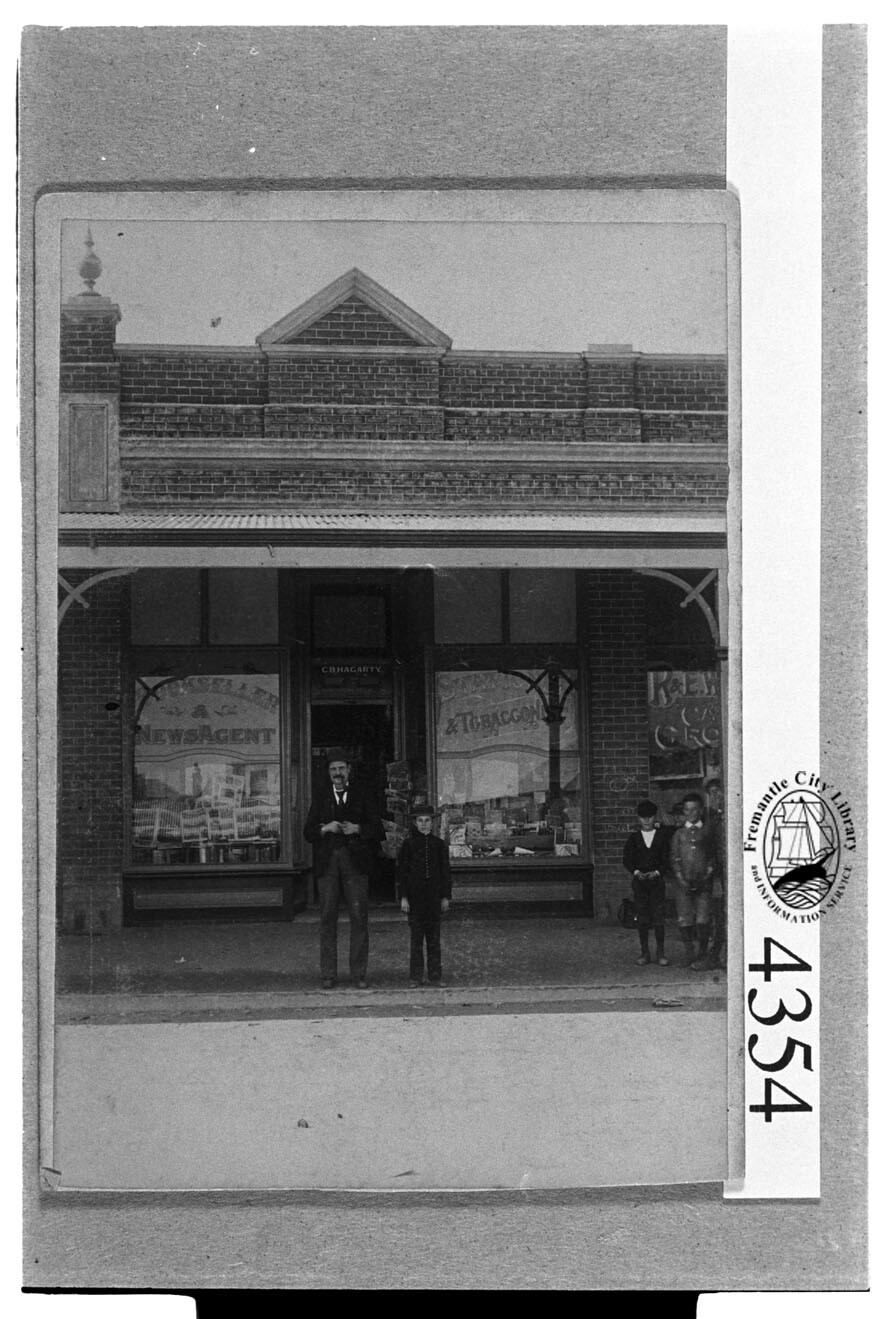 Charles Bernard Hagarty outside his business