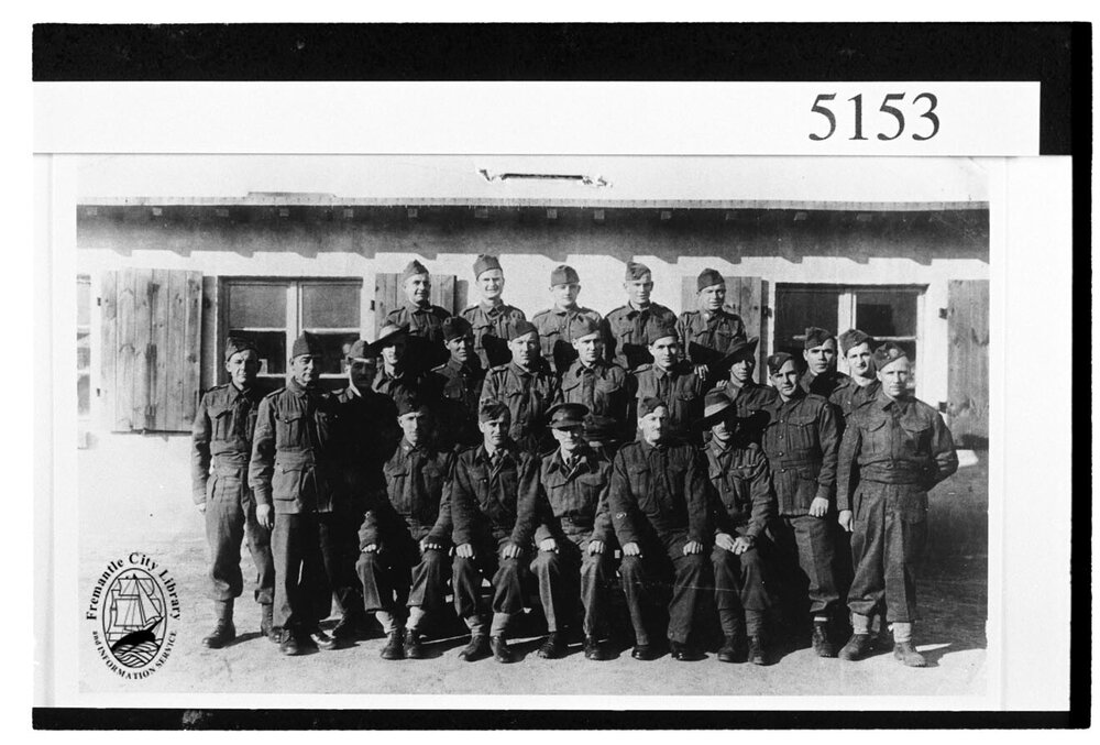 Private Ernest Forsyth in a group photograph of prisoners of war in Germany during the Second World War.