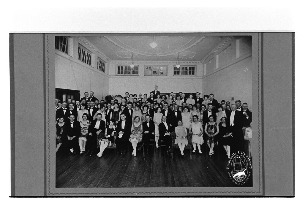 Group photograph of attendees at a ball or dance