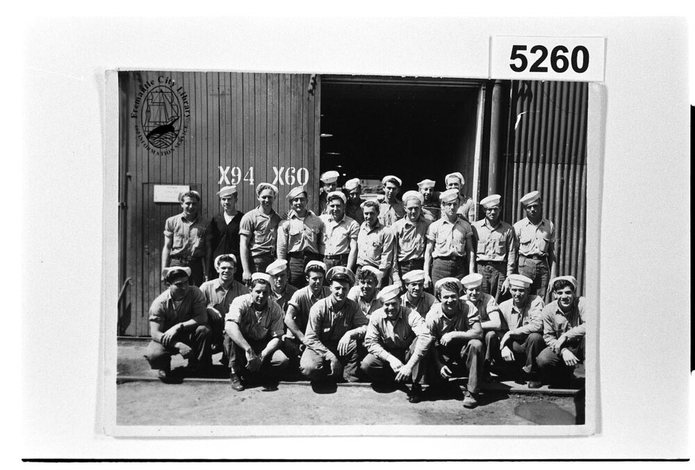 American sailors outside the Carpenters' Shop on the wharf