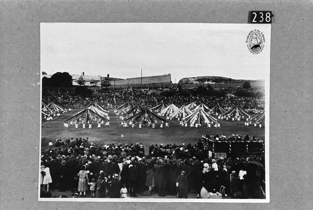 Maypole dance by 5000 school children on Fremantle Oval to mark the visit of the Duke and Duchess of York