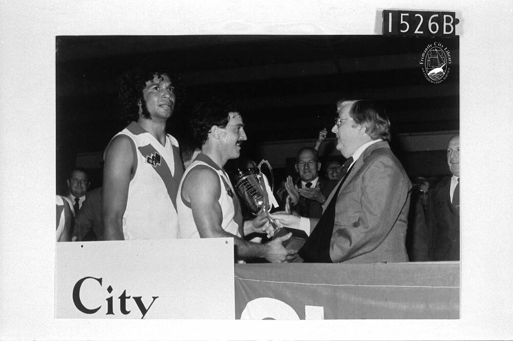 South Fremantle Captain Noel Carter receiving a trophy