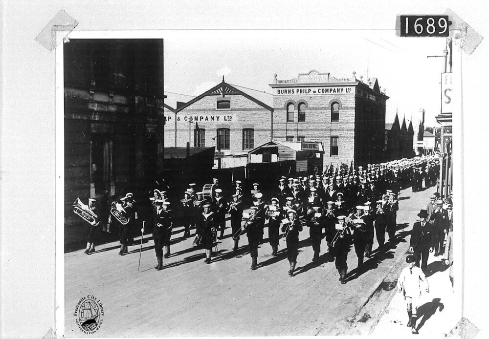Naval band marching down William Street