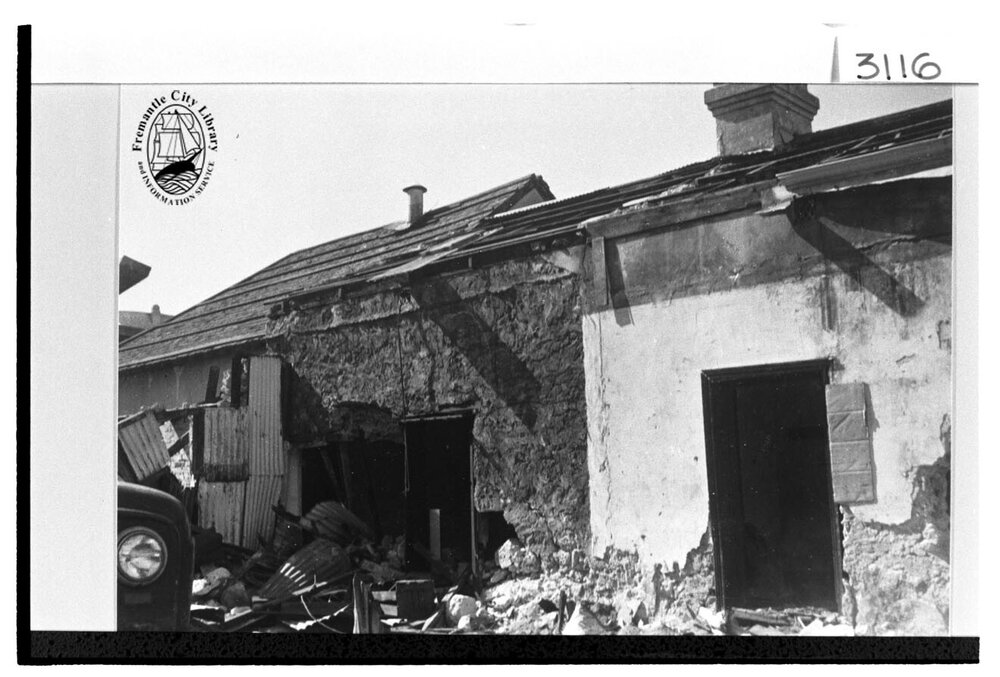 Demolition of stone cottages
