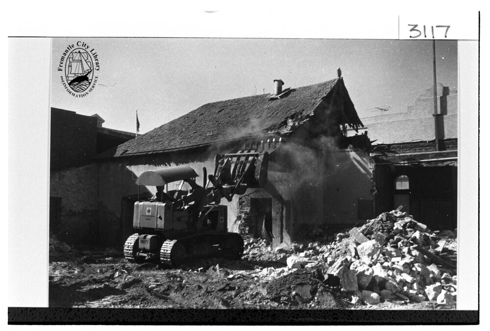 Demolition of stone cottages