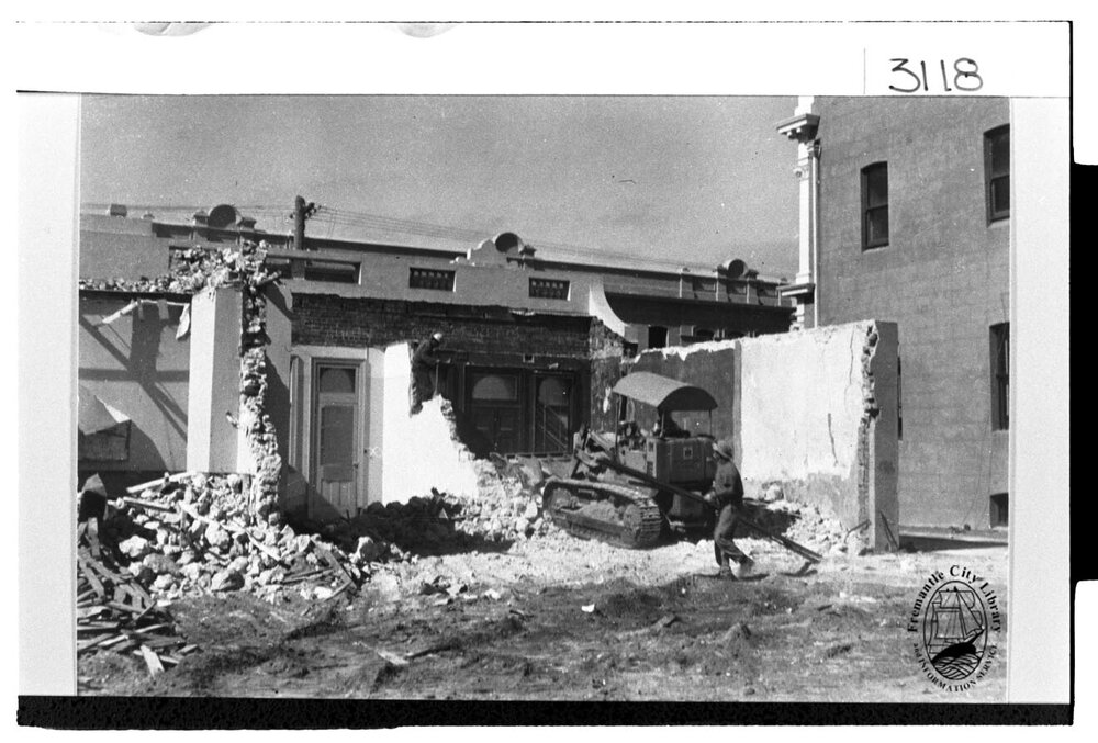 Demolition of stone cottages