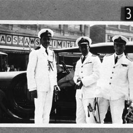 Could be Rear Admiral with Flag Lieutenant on left from H.M.A.S. Sydney or Melbourne.