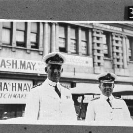 Could be Rear Admiral with Flag Lieutenant on left, standing at corner of William and High Street