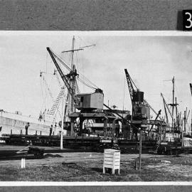 Echunga, Adelaide Steamship Company vessel, unloading railway iron at North Wharf