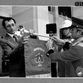 Deputy Mayor John Cattalini with banner