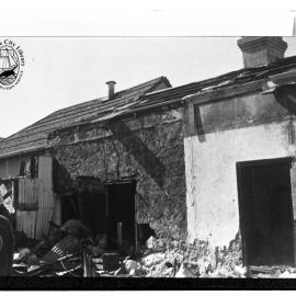 Demolition of stone cottages