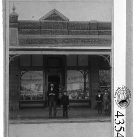 Charles Bernard Hagarty outside his business