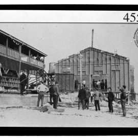 Crew working on demolition of old dressing shed