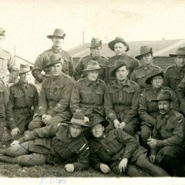 Photo of Ross Rummer with a group of soldiers.