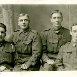 Ross Rummer in a studio portrait with three other soldiers.