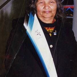 Olympic Torch Relay with Aboriginal Elder Marie Thorne holding the torch